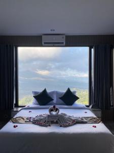 Postel nebo postele na pokoji v ubytování Devanora Hotel & Resto