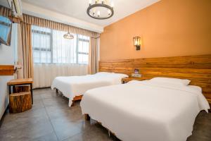 Letto o letti in una camera di Tianmenshan Loft Art Inn