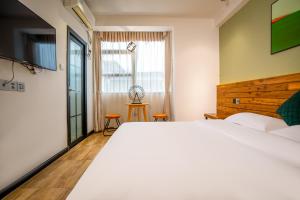 Letto o letti in una camera di Tianmenshan Loft Art Inn