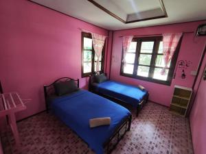 Postel nebo postele na pokoji v ubytování Janzo House