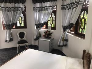 Letto o letti in una camera di Kingz and Queenz - Negombo