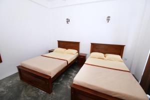 Postel nebo postele na pokoji v ubytování Shalom Bungalow
