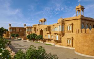 a large brick building with a tower on top at Storii By ITC Hotels, Jaisalmer in Jaisalmer