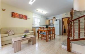 a living room with a couch and a table at Awesome Home In Miami Playa With Wifi in Miami Platja