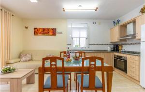 a kitchen and living room with a table and chairs at Awesome Home In Miami Playa With Wifi in Miami Platja