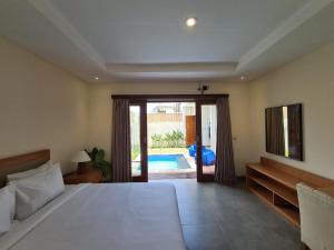 Ένα ή περισσότερα κρεβάτια σε δωμάτιο στο Villa Maha 2-BR Private Pool