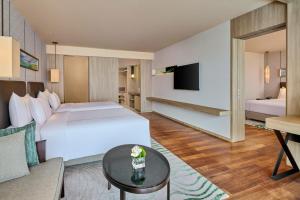 Voodi või voodid majutusasutuse Shenzhen Dameisha Kingkey Palace Hotel toas