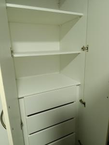 a white closet with white drawers and shelves at MIRAFLORES APART-10Beds-11Persons-Pool-Grill-Garage-Near Kennedy Park in Lima