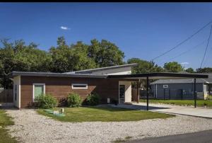 a small house with a pavilion in front of it at Large Hot Tub! Family Friendly - Stylish and Cozy in Canyon Lake