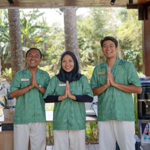 a group of three people in green scrubs performing aorativeorativelicationlicationlication at TIKA Lombok in Kuta Lombok