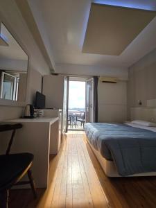 Posteľ alebo postele v izbe v ubytovaní Aegean Sea Rooms