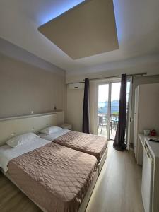 Posteľ alebo postele v izbe v ubytovaní Aegean Sea Rooms