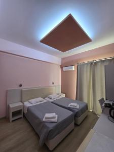 Posteľ alebo postele v izbe v ubytovaní Aegean Sea Rooms