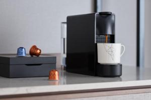 a coffee maker and a cup on a counter at ANA InterContinental Tokyo by IHG in Tokyo