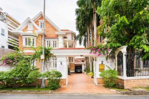 a house with flowers on the front of it at KN 2 Villa - Venuestay in Ho Chi Minh City