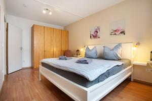 Ένα ή περισσότερα κρεβάτια σε δωμάτιο στο Wohnung C1 - Haus A Cappella +21 φωτογραφίες
