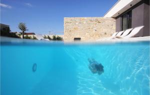 a person in the water in a swimming pool at Villa K3 in Zadar