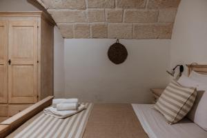 Postel nebo postele na pokoji v ubytování VinTage rooms