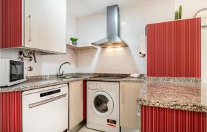 a kitchen with a washer and a washing machine at Charming Apartment With Pool in Vera