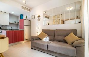 a living room with a couch and a kitchen at Charming Apartment With Pool in Vera