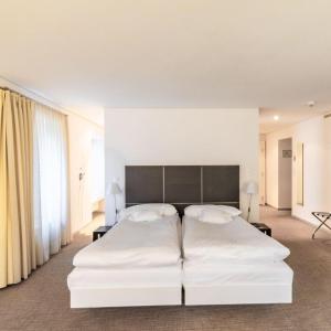 Rúm í herbergi á Hôtel Au Terminus