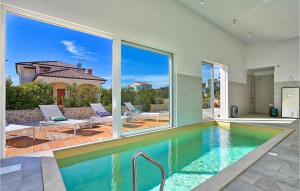 a swimming pool with a view of a house at Villa Vela Muline in Zadar +52 photos