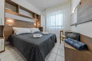 Posteľ alebo postele v izbe v ubytovaní Hotel Stacchini