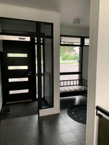a room with a door and a view of a porch at Villa Venetsia tilava huvila in Lapua