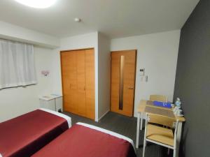 Ένα ή περισσότερα κρεβάτια σε δωμάτιο στο incense上野根岸601