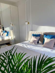 Ένα ή περισσότερα κρεβάτια σε δωμάτιο στο GOLD Apartment Uniejów