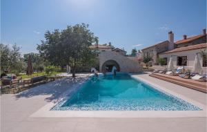a swimming pool in the middle of a house at Villa Lv in Umag +51 photos