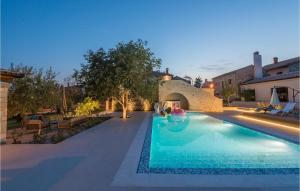a swimming pool in the backyard of a house at Villa Lv in Umag