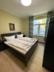 Ένα ή περισσότερα κρεβάτια σε δωμάτιο στο Apartmenthaus Rankestraße 4