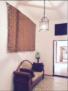 a living room with a couch and a window at Luxurious Villa in Córdoba + Pool in Córdoba