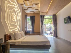 Ένα ή περισσότερα κρεβάτια σε δωμάτιο στο The Thousand Village - Mũi Né +39 φωτογραφίες