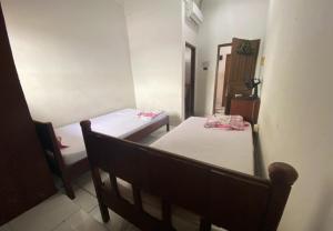 Postel nebo postele na pokoji v ubytování Hotel Candra Adigraha