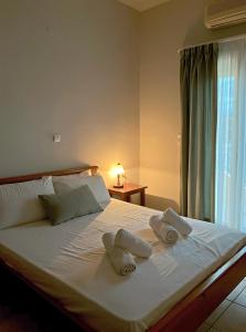 A bed or beds in a room at Panos Village