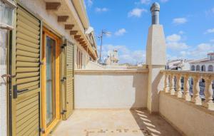 an open door of a house with a balcony at Gorgeous Home In Santa Pola With Wifi in Santa Pola