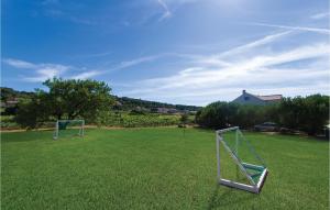 two goal posts in a field of grass at Luxurious Home In Lumbarda With Sauna in Lumbarda