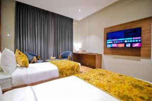 Katil atau katil-katil dalam bilik di The Olive Hotel Srinagar