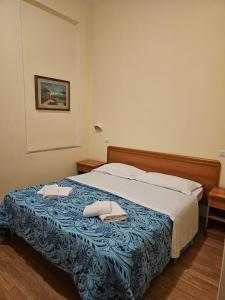 Ένα ή περισσότερα κρεβάτια σε δωμάτιο στο Hotel Liberty +12 φωτογραφίες