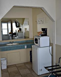 A kitchen or kitchenette at Centre Suite Inns Motel