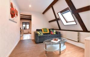 a living room with a couch and a table at 2 Bedroom Lovely Apartment In Rouffach in Rouffach