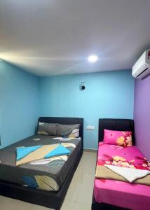 Postel nebo postele na pokoji v ubytování ARK Business Rawang hotel