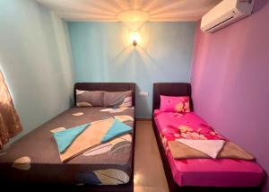 Postel nebo postele na pokoji v ubytování ARK Business Rawang hotel