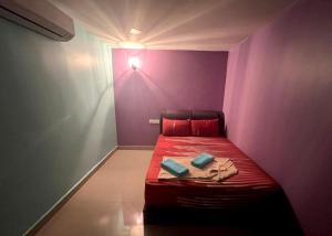Postel nebo postele na pokoji v ubytování ARK Business Rawang hotel
