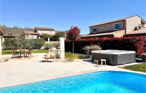 a swimming pool with a hot tub in a yard at Villa Toscana in Umag