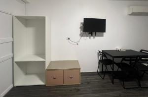 TV a/nebo společenská místnost v ubytování Annerley Motor Inn