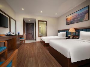 Ένα ή περισσότερα κρεβάτια σε δωμάτιο στο Halong Boutique Hotel