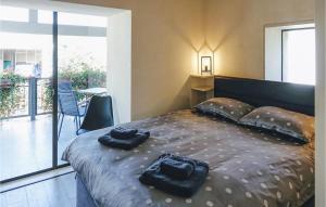 a bedroom with a bed with two towels on it at Villa Pepa in Zarečje +49 photos